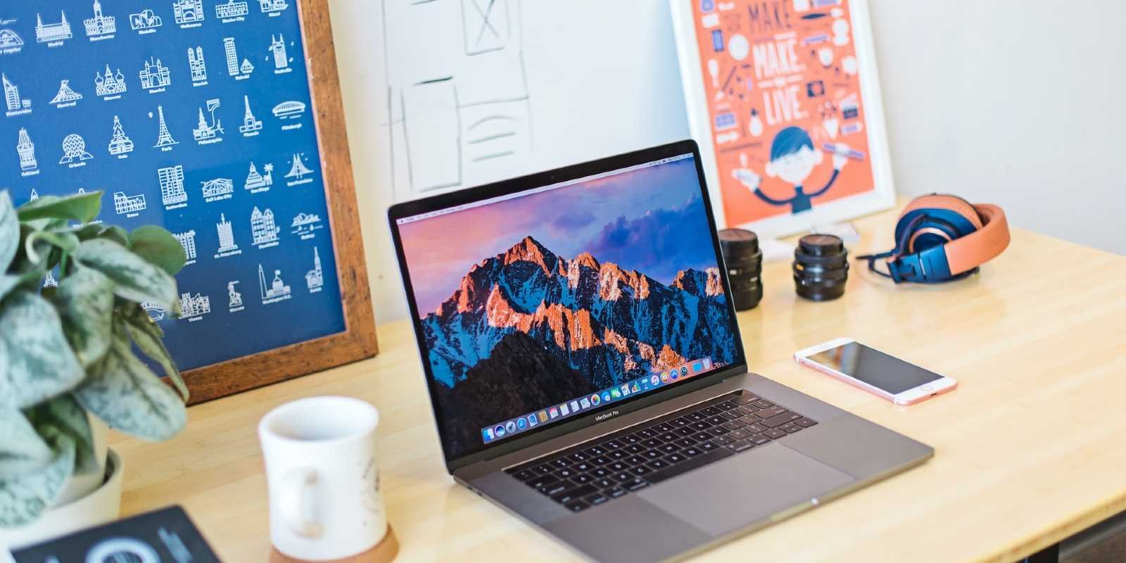 Digital marketing workspace with creative tools, laptop, and branding elements for online marketing.